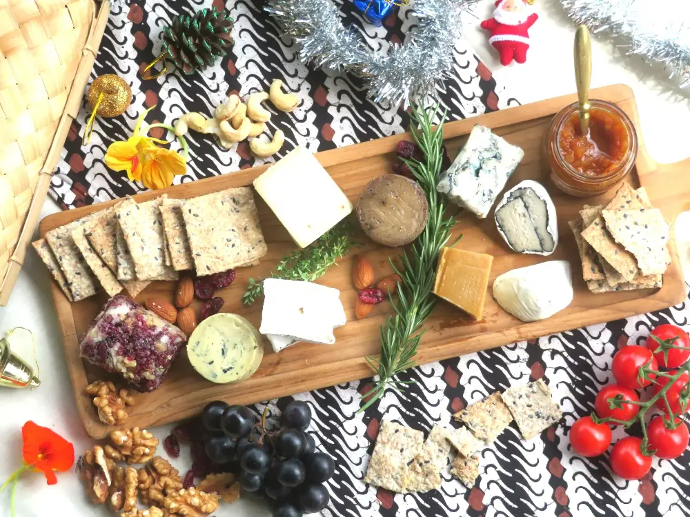 Vegan cheeseboard with crackers, chutney, grapes and nuts